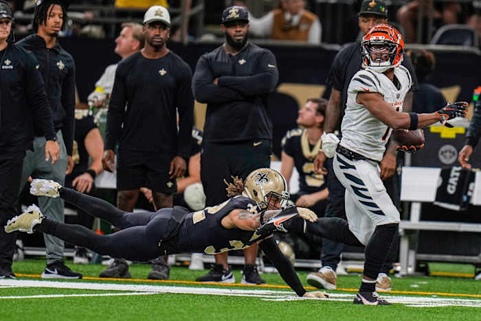 Cincinnati Bengals wide receiver Ja'Marr Chase (1) breaks a tackle by New Orleans Saints safety Tyrann Mathieu (32) to score a touchdown with 2:10 remaining in the fourth quarter and give the Bengals the win during an NFL Week 6 game, Sunday, Oct. 16, 2022, at Mercedes-Benz Superdome in New Orleans. Cincinnati Bengals At New Orleans Saints Oct 16 043